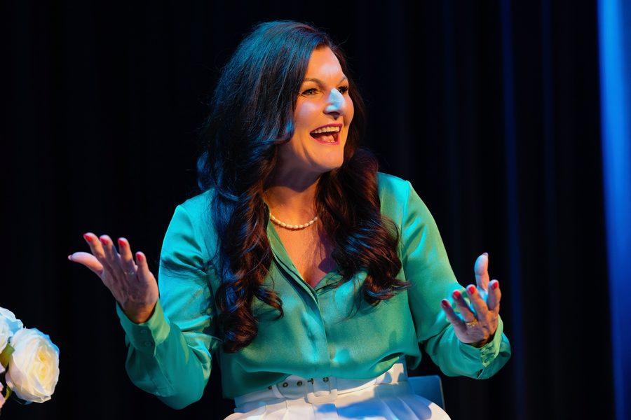 Annie Gibbins speaking on stage